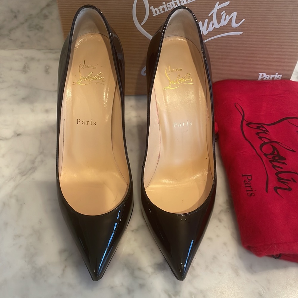 Barely worn Christian Louboutin Pigalle Follies 100 in patent black. Size 38.5